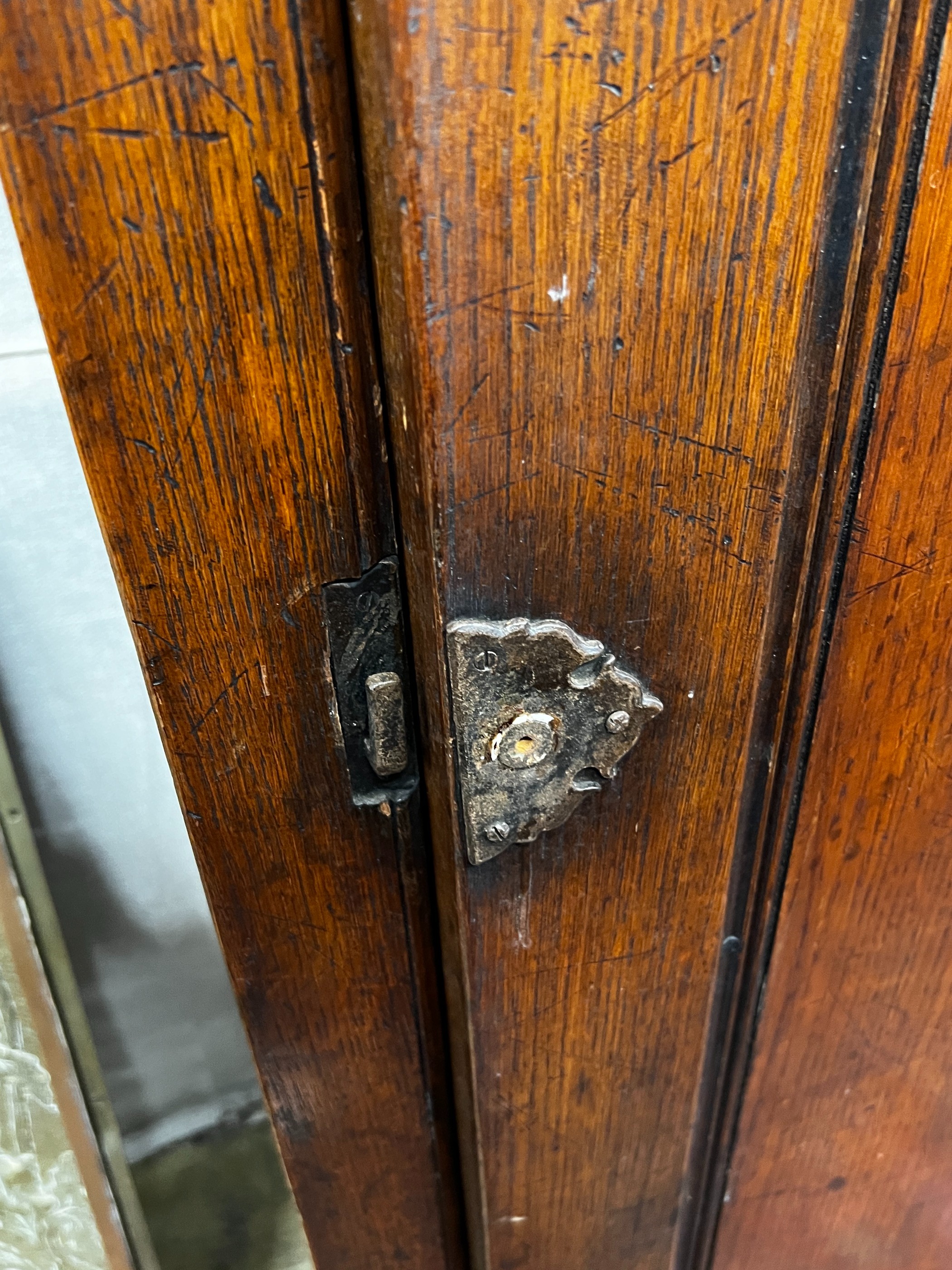 A 17th century style carved oak hall cupboard, width 76cm, depth 46cm, height 167cm